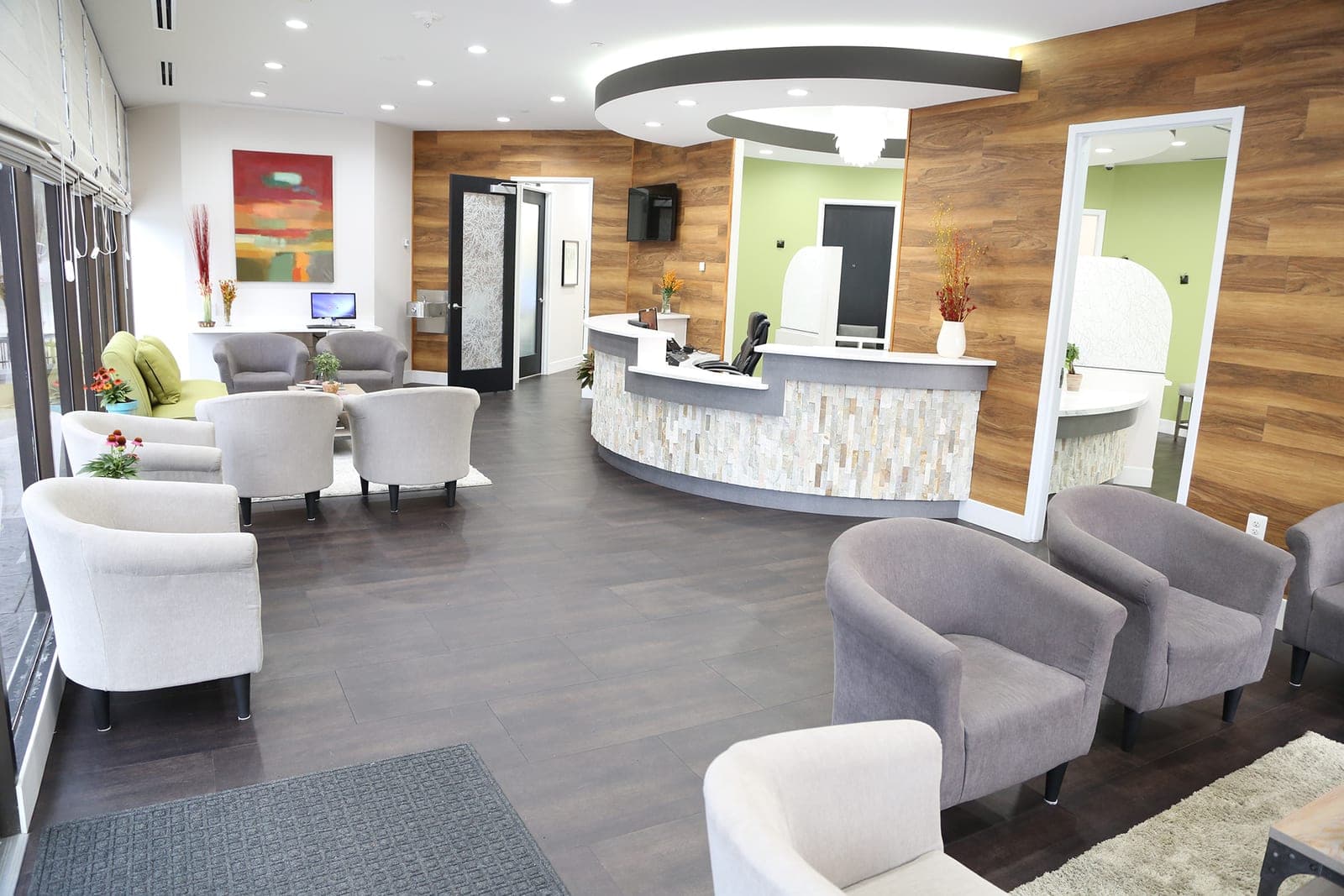 The reception, waiting area, and stone-front front desk at Sarubin Family Dental in Pikesville, Maryland