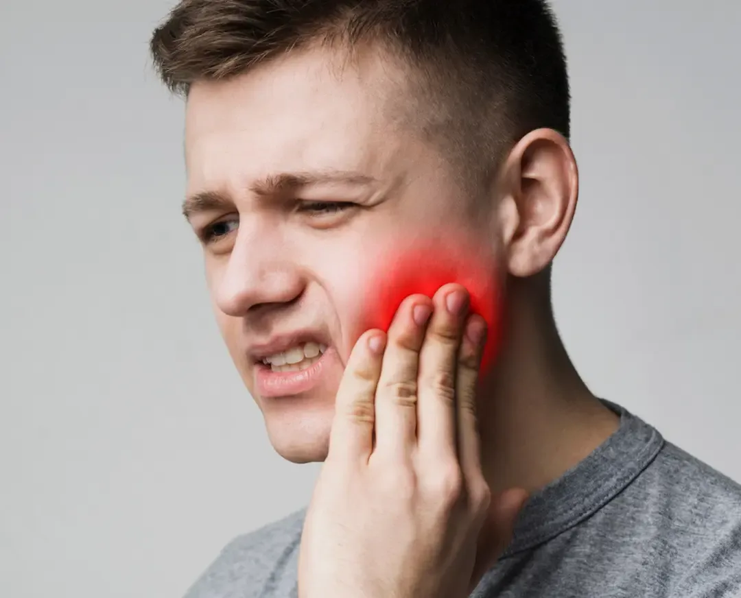 A reassuring dentist examining a relieved patient during a same-day emergency visit